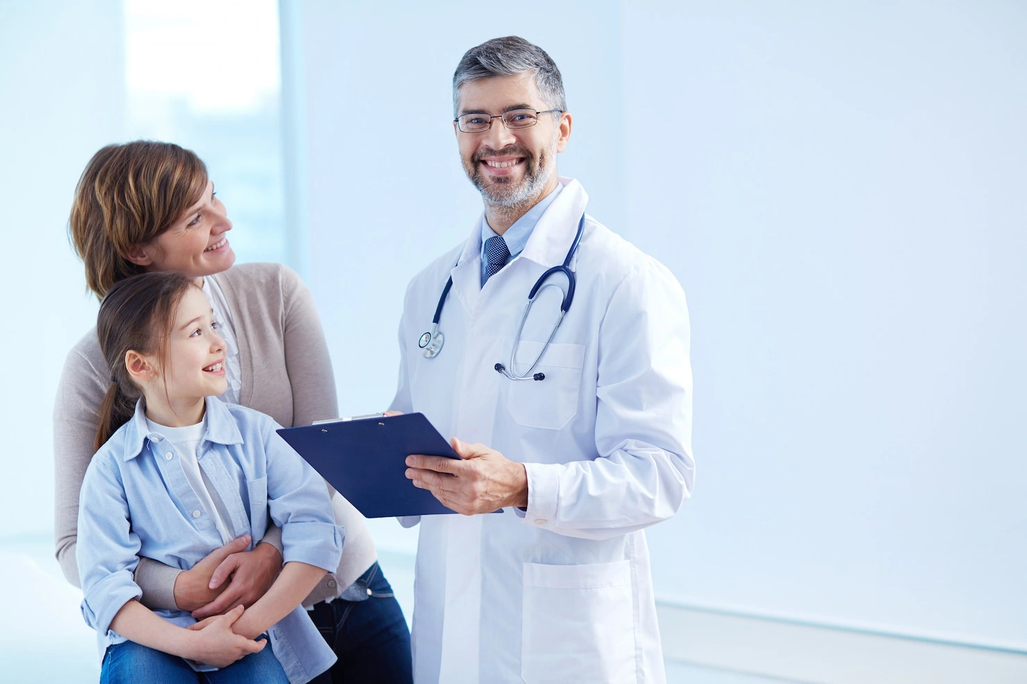 happy-doctor-holding-clipboard-with-patients_1098-